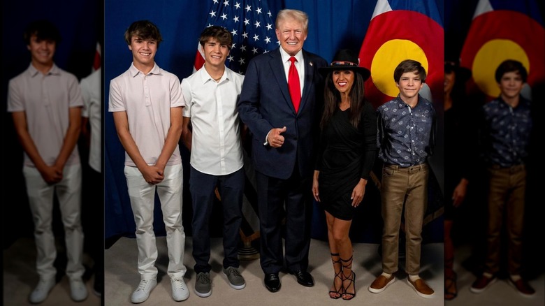 Lauren Boebert posing with her sons and Donald Trump