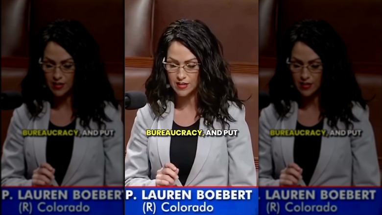Lauren Boebert speaking at a congressional hearing with dark, overly greasy hair