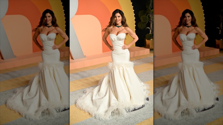 Lauren Sánchez Bezos smiles wearing a mermaid-style white dress.