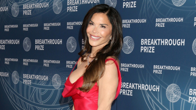 Laure Sánchez in a red dress posing on the red carpet at the 11th Breakthrough Prize Awards
