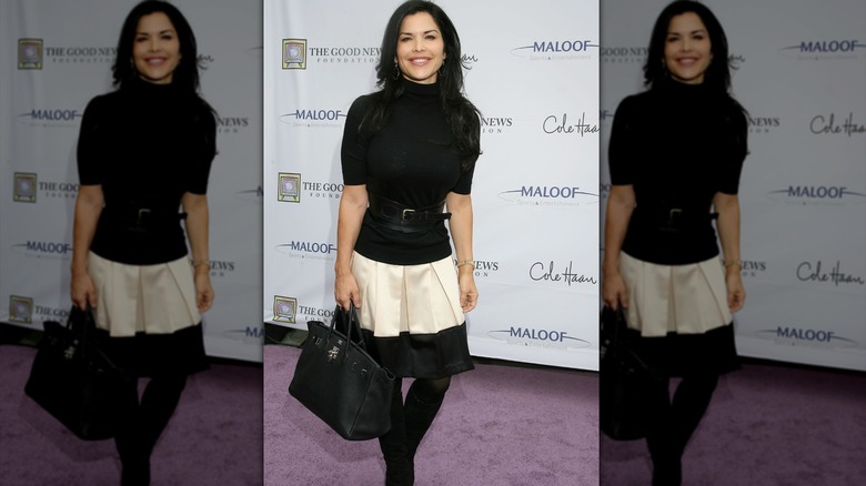 Lauren Sánchez wearing a black-and-white drop skirt and a black turtleneck