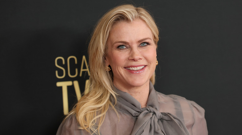 Alison Sweeney smiling in a grey top