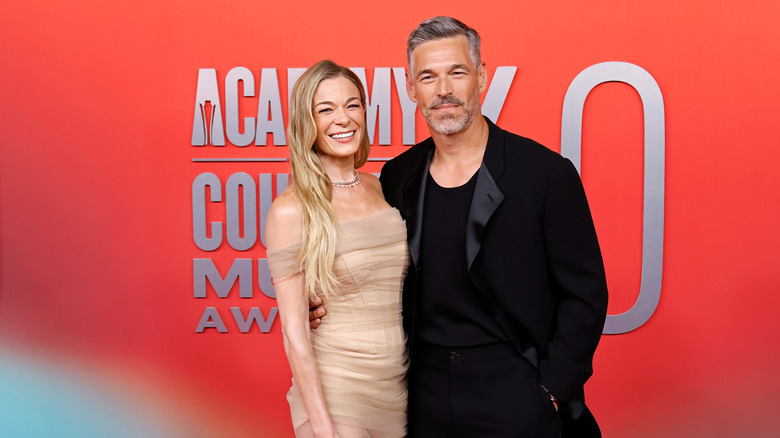 LeAnn Rimes and Eddie Cibrian pose arm in arm at an award show