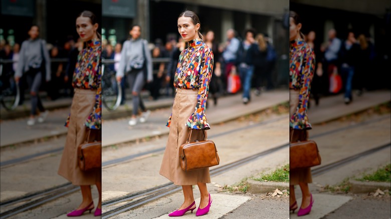 Woman in a maxi beige leather skirt
