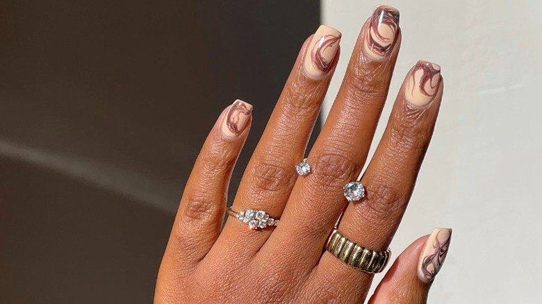 iced coffee nails with milky swirls