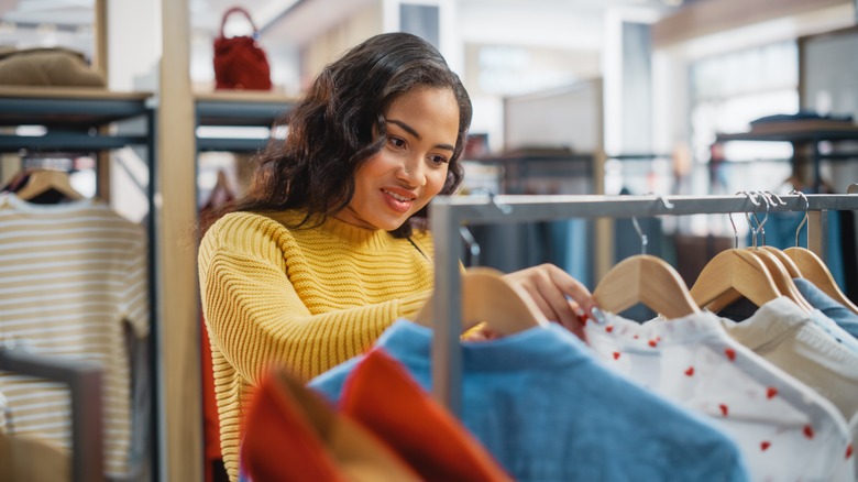 woman browsing clothing store