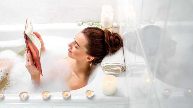 woman reading in bath