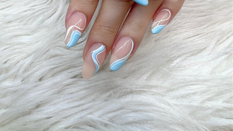 White, light blue, clear manicure design