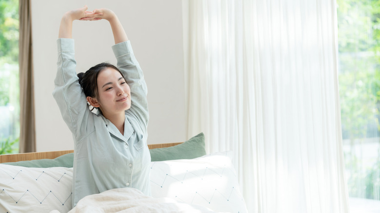 woman waking up in bed