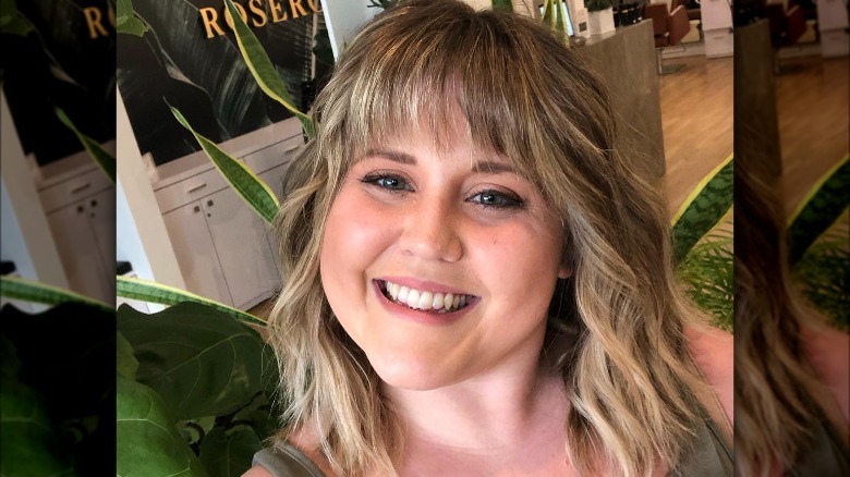 A woman with a linen blond shag