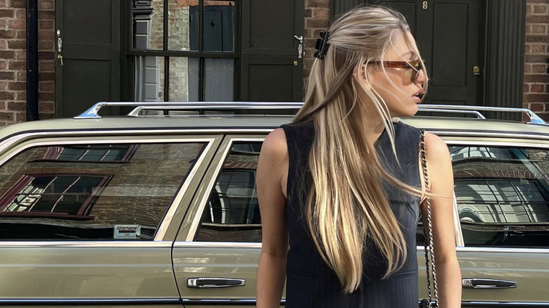 A woman with linen blond balayage