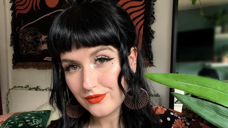 Bold orange lipstick