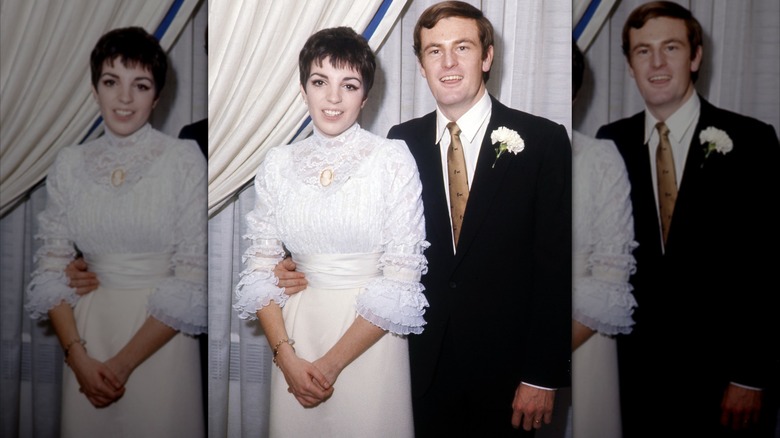 Liza Minnelli wearing a white lace dress posing next to her husband Peter Allen wearing a suit.