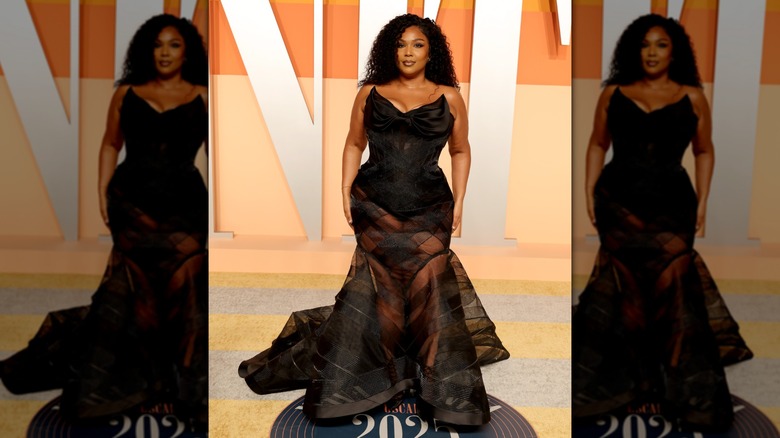 Lizzo in a black corset dress at the Vanity Fair Oscar Party