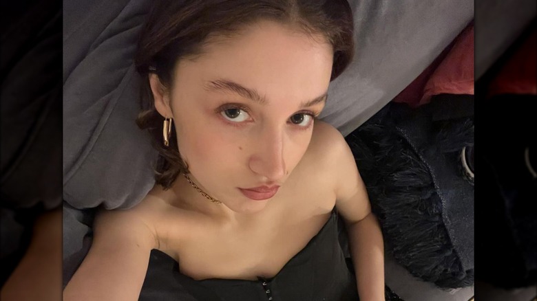 Pouty brunette taking a selfie