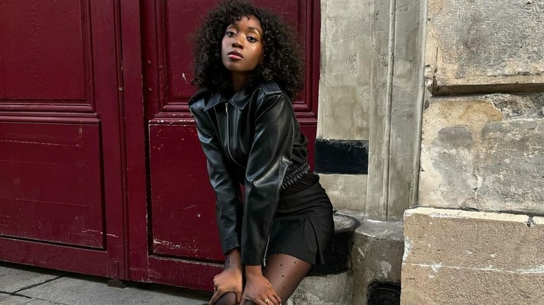 Curly brunette woman blank stare