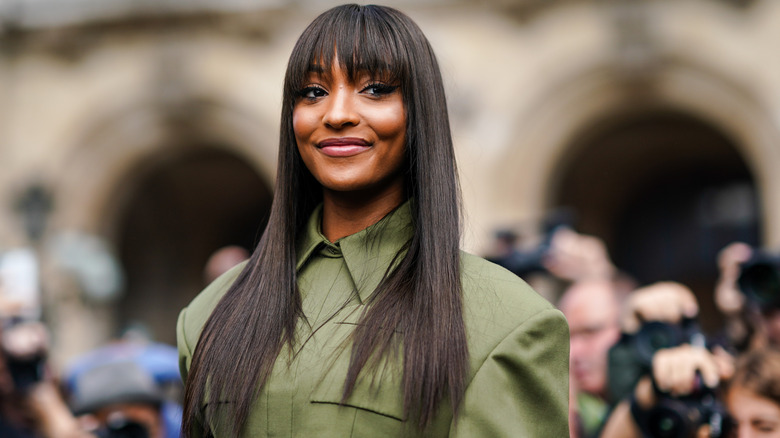 Woman with long black hair bangs