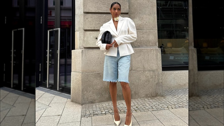 Girl wearing a blazer and jorts