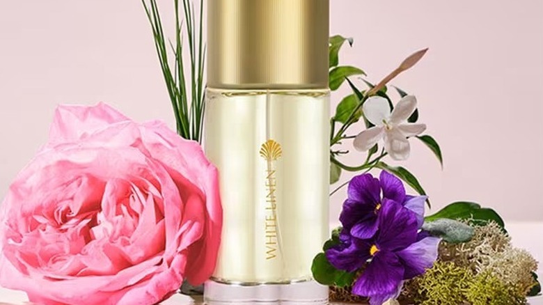 White Linen perfume among flowers