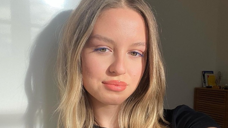 woman wearing blue mascara