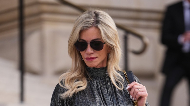 A woman with face-framing layers