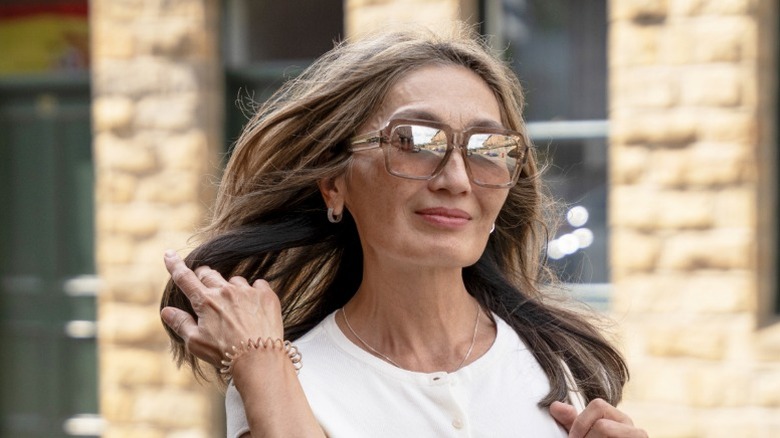 A middle-aged woman with long, thick hair