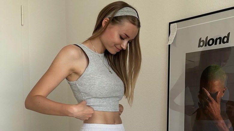 Girl wearing a baby tank