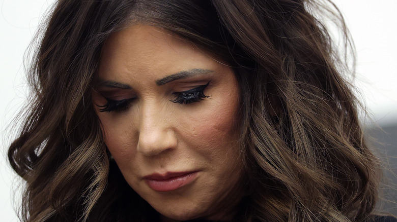 Kristi Noem looking downwards during a homeland security meeting