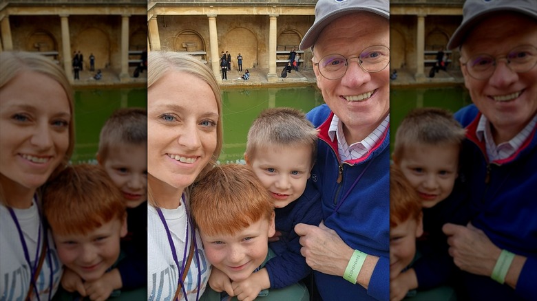 John and Chelsea Rose smiling with their sons