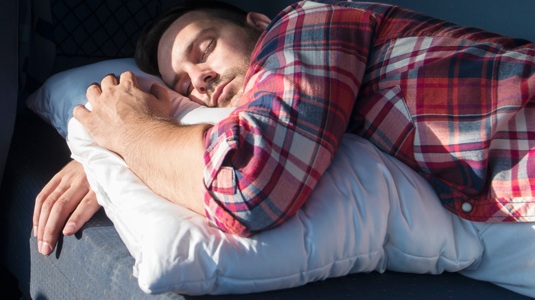 man napping on a couch