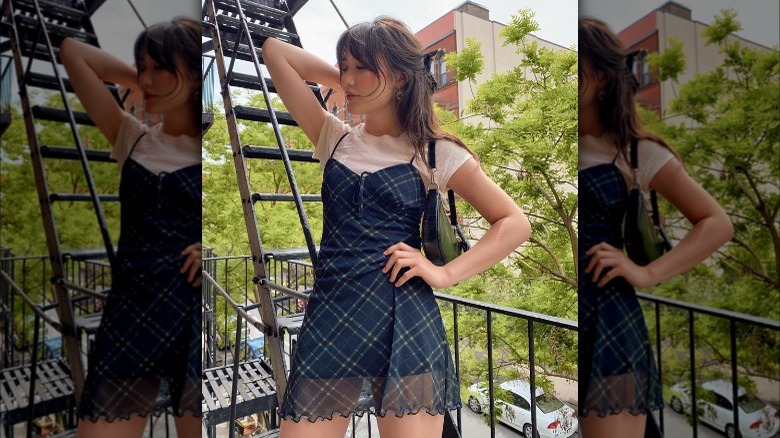 Woman wearing t-shirt under slip skirt