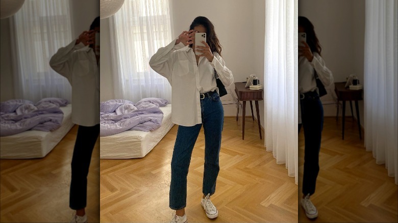 Woman with half-tucked shirt in jeans