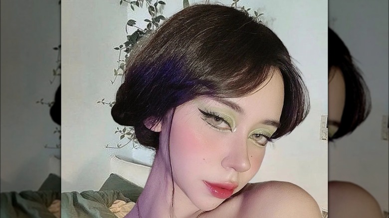 Mint green eyeshadow and rosy lips