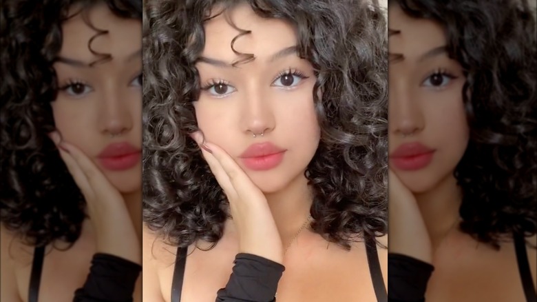 Coquette makeup with white eyeliner