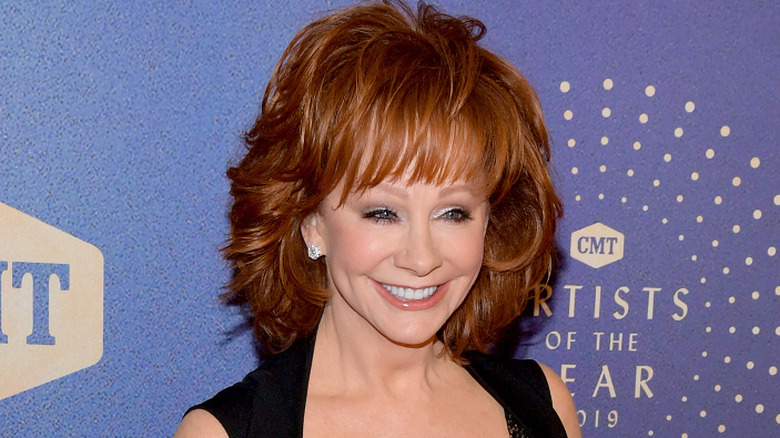 Reba McEntire wearing a black dress