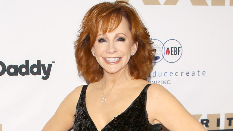 Reba McEntire wearing a black dress