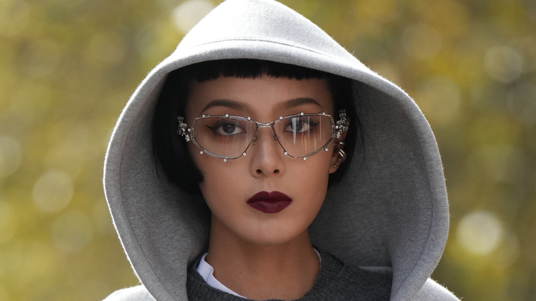 Gray hooded sweatshirt maroon lipstick