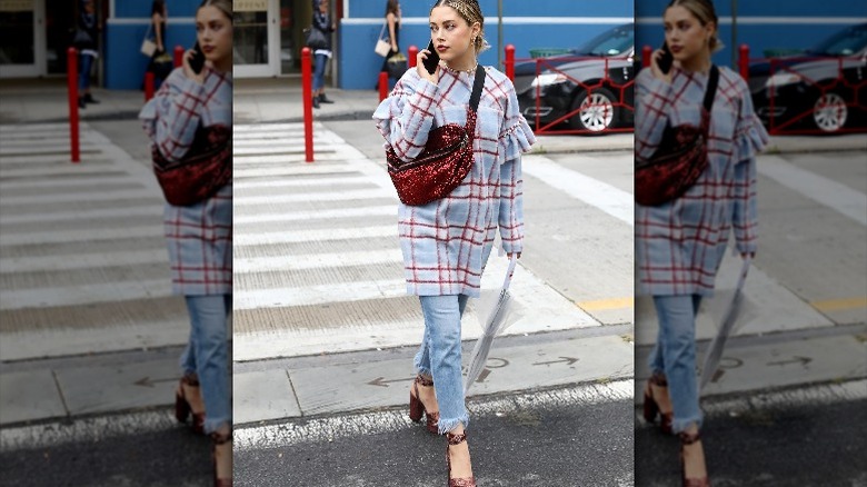 Girl wearing red sequin fanny pack.