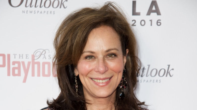 Jane Kaczmarek with slightly fading brunette hair photographed smiling at The Pasadena Playhouse Gala in 2016