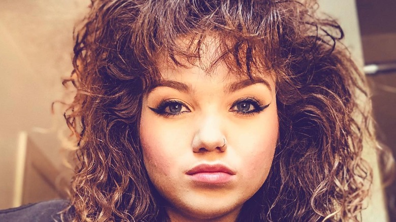 Girl with curly mall bangs