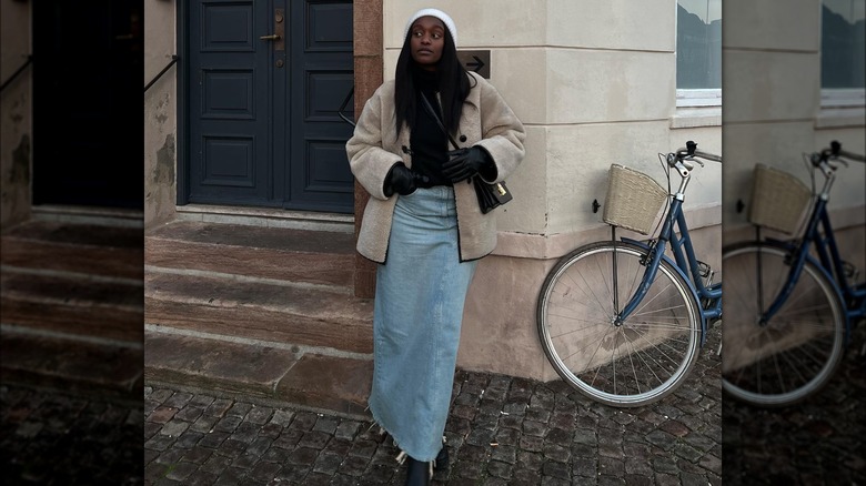 woman wearing denim midi skirt