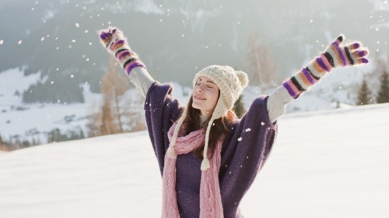Woman smiling in snowy field