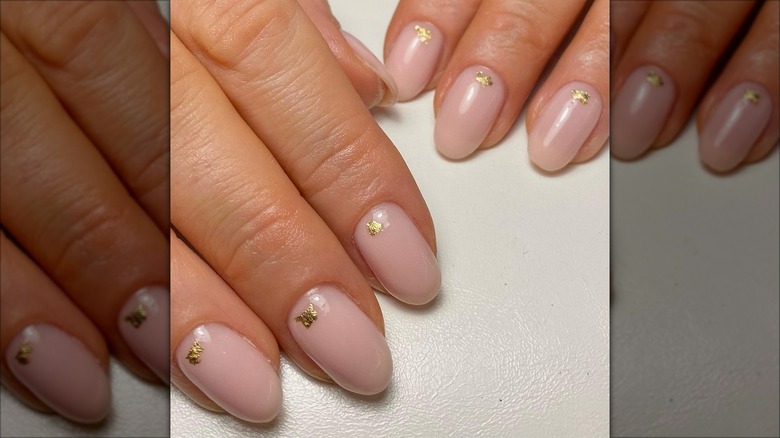 rounded flesh-toned nails golden specks