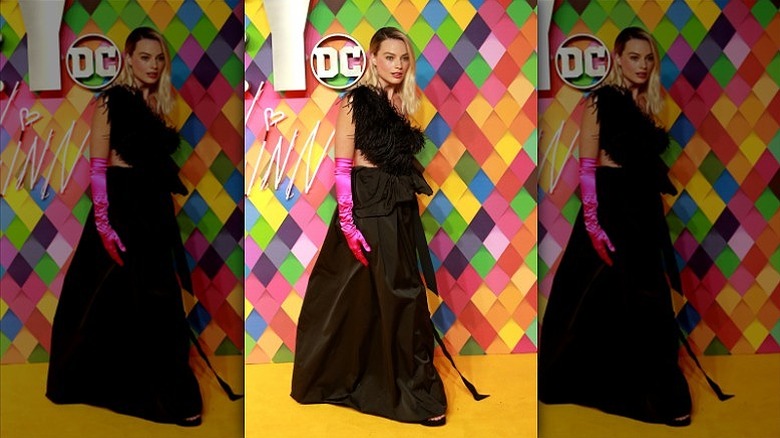 margot robbie wearing hot pink gloves