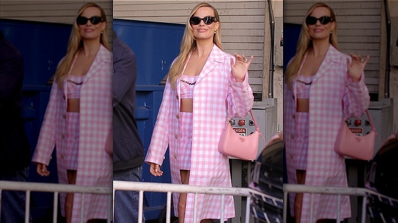 margot robbie wearing pink checkered outfit