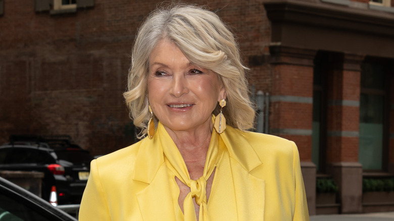 Martha Stewart smiling in a yellow outfit