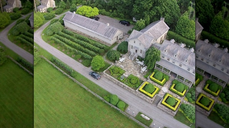 An aerial shot of Martha Stewart's New York farm and its surrounding greenhouse and green grounds