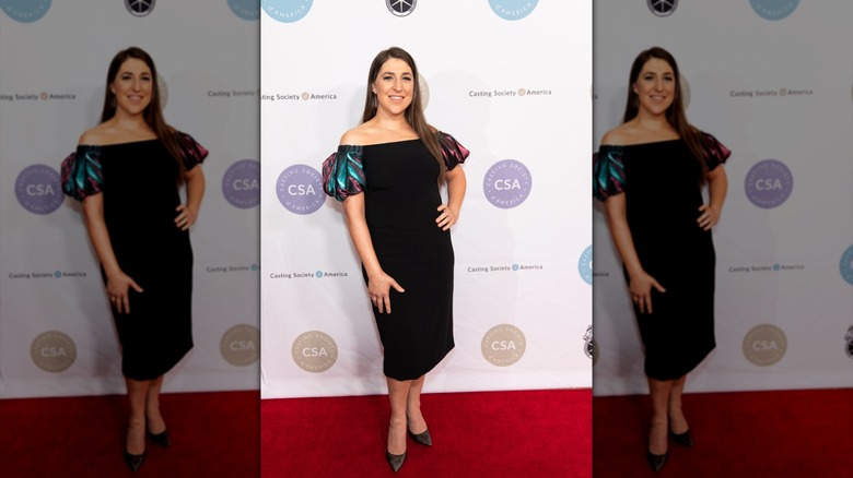 Mayim Bialik in a black midi with volumized sleeves