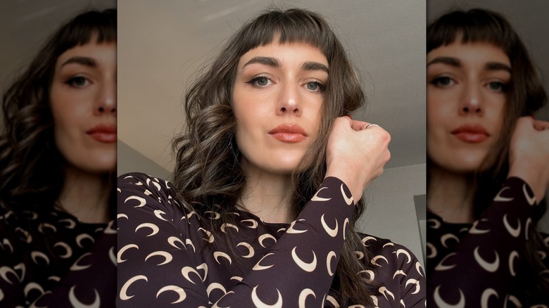 Woman with baby bangs