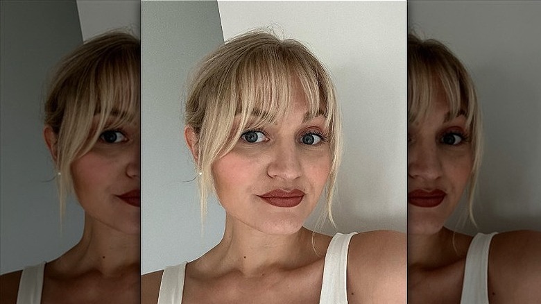 woman with medusa bangs and updo 